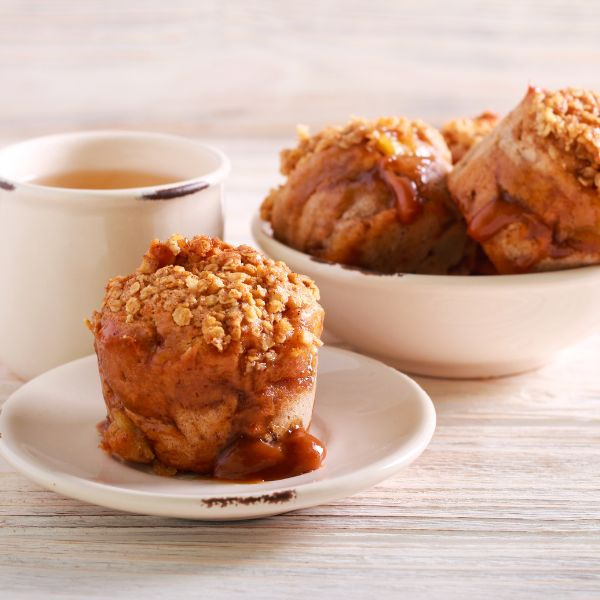 Caramel Apple Muffins on a table with coffee