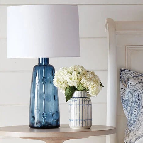 blue glass lamp base with white lamp shade