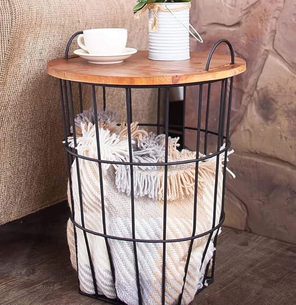 a table with a basket and a cup of coffee, functional furniture, wooden table top storage basket