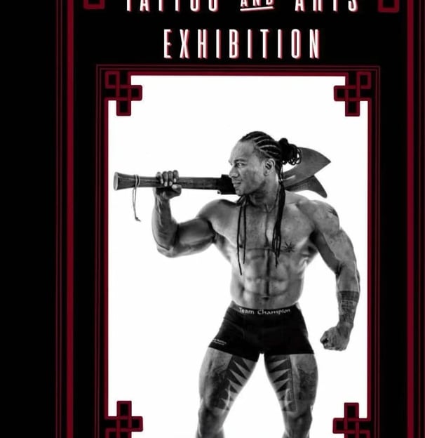 Polynesian tattoo artist bodybuilding fitness m,odel carl cocker with Tongan war club