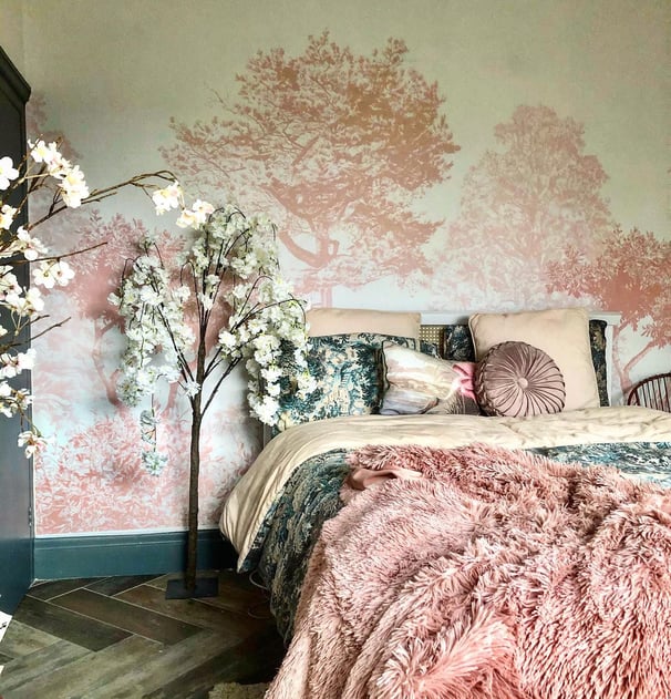 pink tree and white floral wallpaper with pink and green bedding with faux white flowers