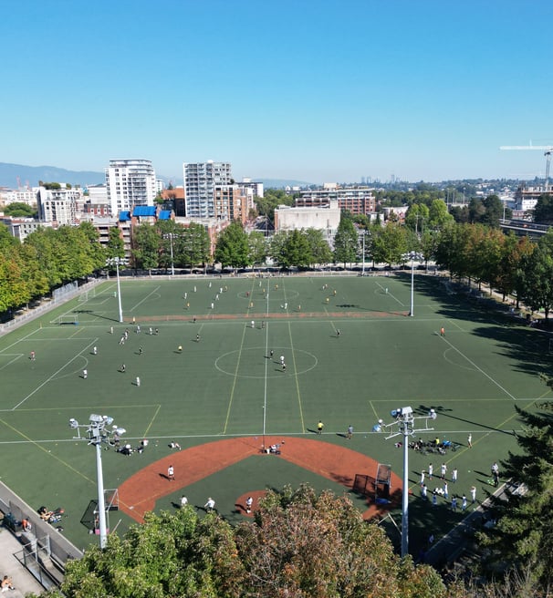 a soccer field with a lot of people playing soccer