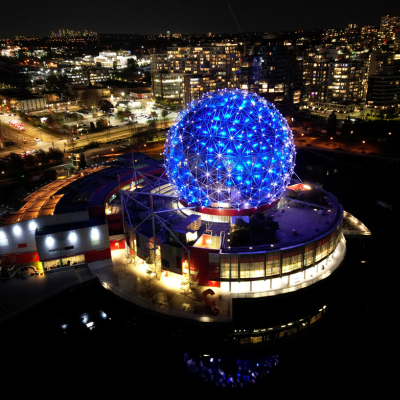 a large blue ball in the middle of a city