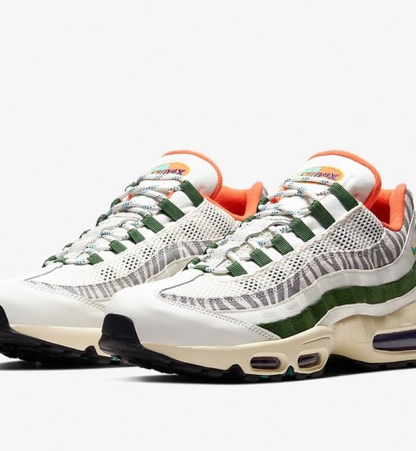Nike Air Max 95 'Era' sneaker in vintage white, gray, and black with layered side panels and visible Air cushioning