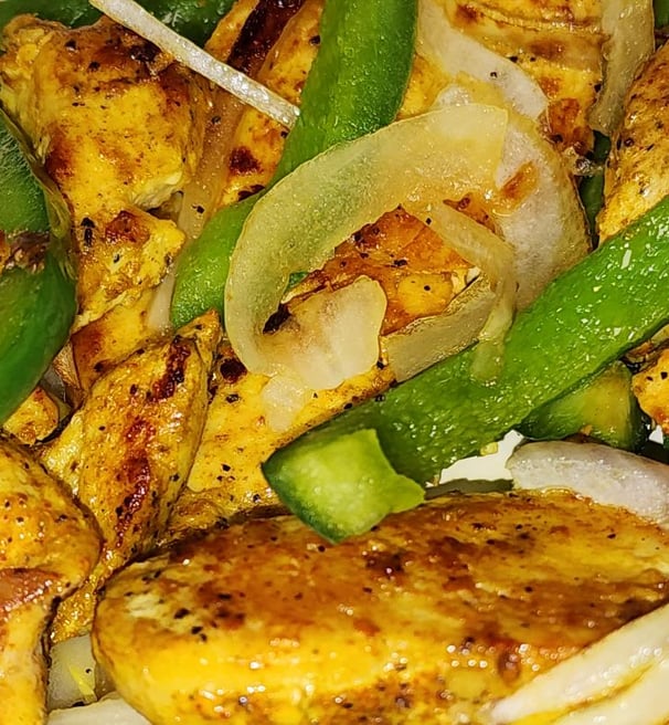 a plate of food with chicken, vegetables and vegetables