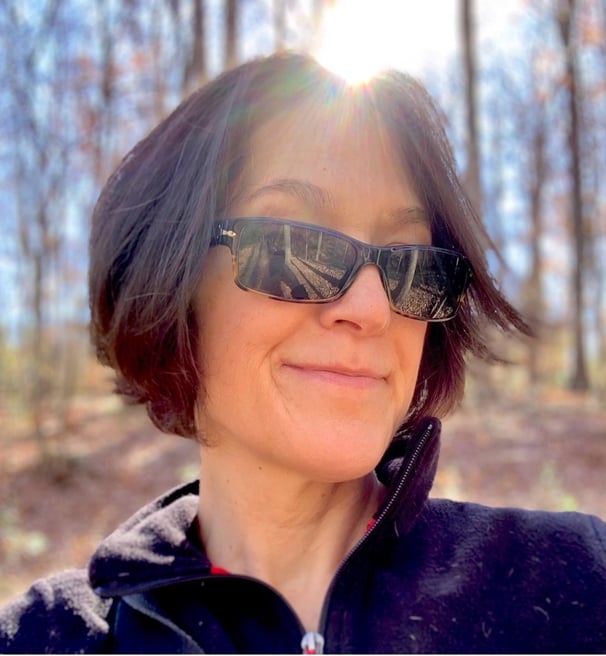 a woman in sunglasses and sunglasses talking on a cell phone