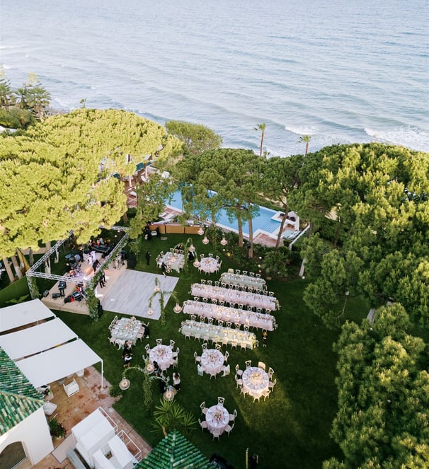 Destination wedding setup and altar in the seaside gardens of Villa El Rincon in Marbella