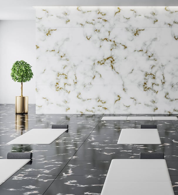a room with a large marbled floor and a plant in the middle