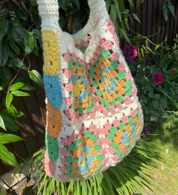 Handmade crochet tote bag with pastel colours pink, green, orange, blue, yellow and white 