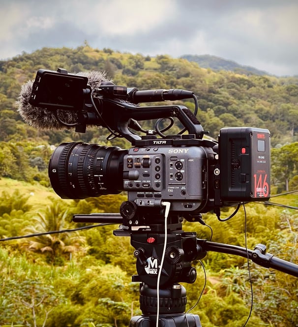 a camera with a video camera attached to a tripod