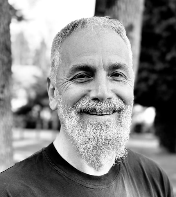 Harun Mehmet Soydan Tai Ji Qi Gong senior instructor of WDP Turkey, smiling outdoors in black shirt