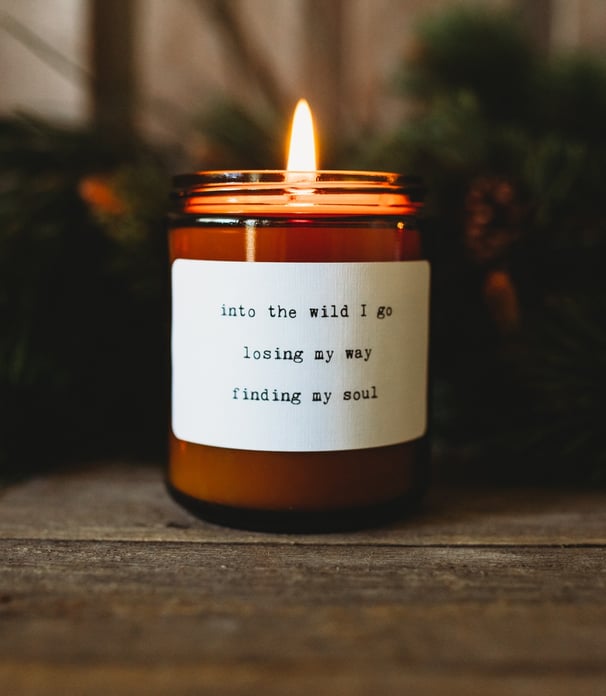 a candle with a candle in a candle holder
