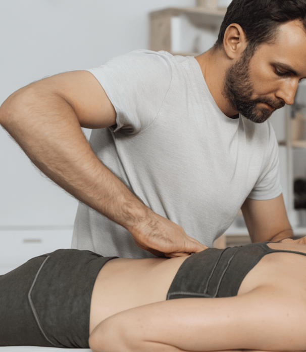 Physiotherapist at work on a woman using Meridian Muscle Reset (MMR) technique