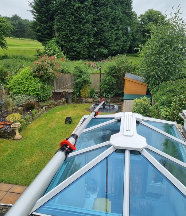 a roof top with a glass roof and a skylight