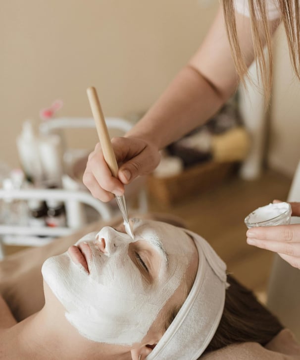 facial mask application on womens face