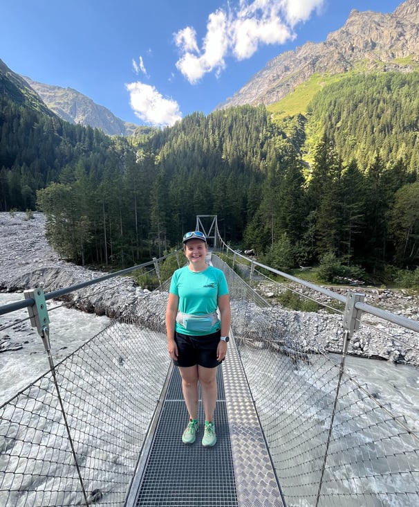 Corinne from Hidden Switzerland Travel crossing the Kander River in the Gasterntal