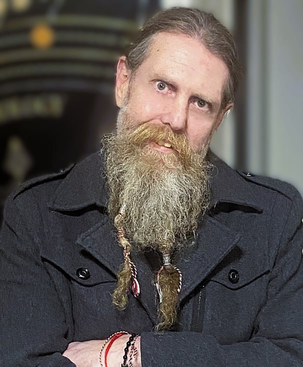 a bearded man posing
