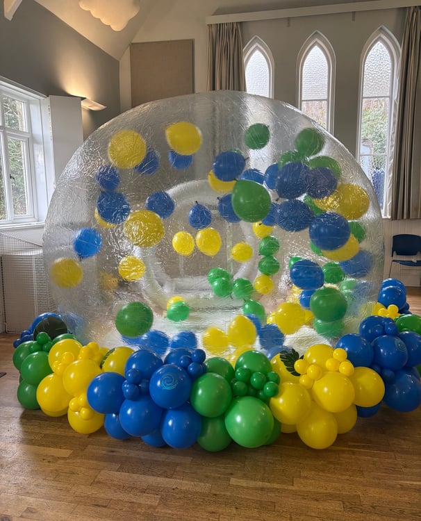 Bubble house with balloon garland set up in tunbridge wells 