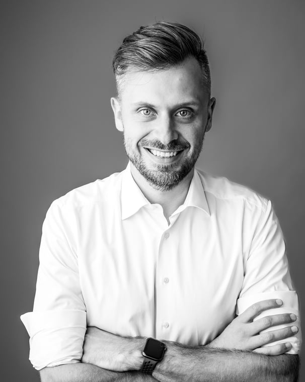 Black and White picture of a professional man in casual shirt smiling