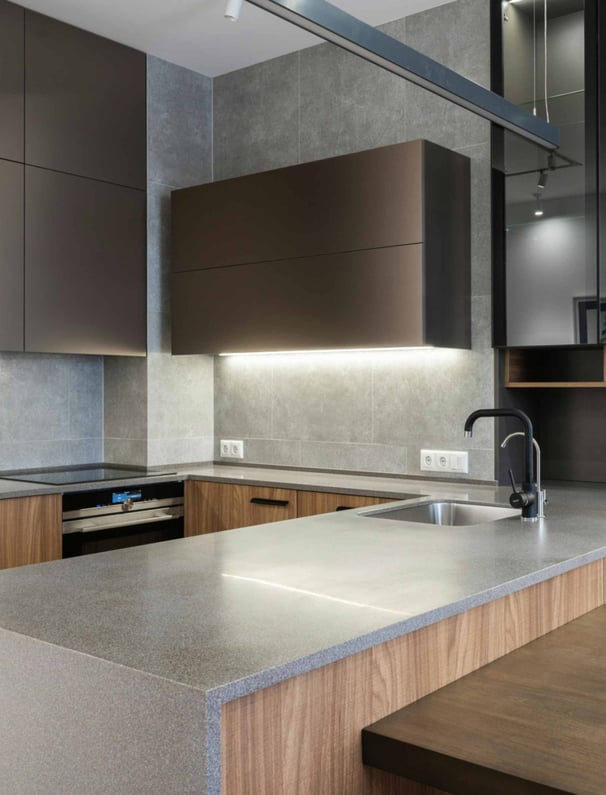 Modern kitchen with brown cabinets and stone counter