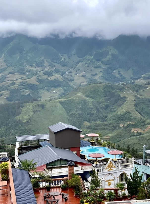 a view of a mountain range with a pool
