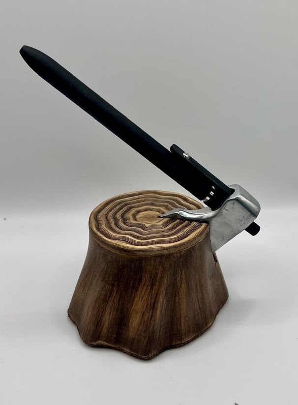 An axe-shaped pen dock