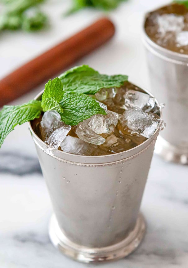 a cup of ice cream with mint tea and mint leaves