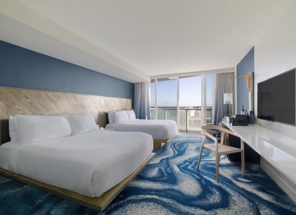 Architectural photo of modern hotel room with ocean view.