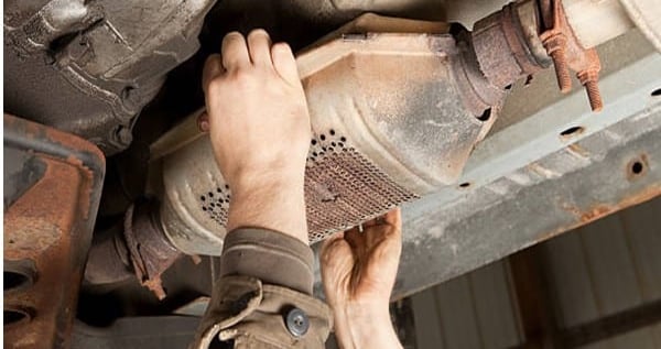 Scrap Yard Near Me Catalytic Converter being removed from car