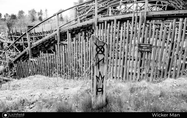 black and white image of Wicker Man ride showing a post with strange markings