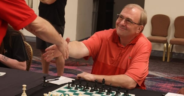 Vegas Chess Coach - Oliver Hemmers is shaking hands with his opponent in an OTB tournament.
