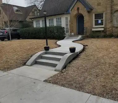 a house with a driveway with steps leading up to a driveway