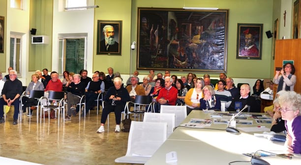 a group of people sitting at tables in a room