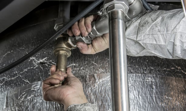 Plumbing business owner meeting with broker