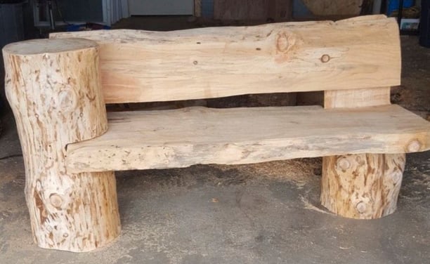 a wooden bench with a wooden bench and a wooden bench