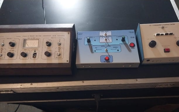 a group of three electronic devices sitting on a table