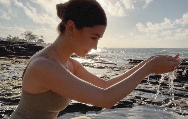 Woman holding healing water