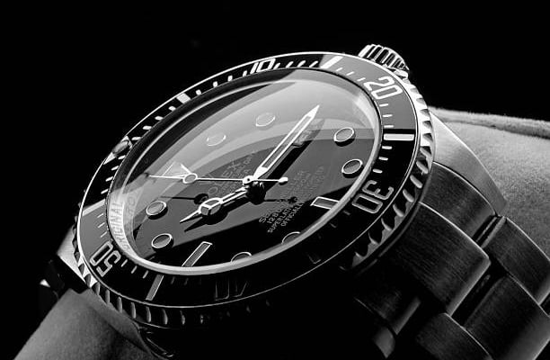 a watch with a black and white photo of a watch