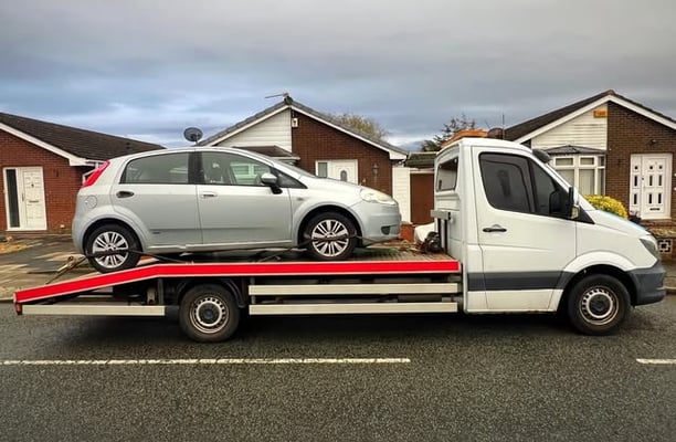a tow truck towing a car