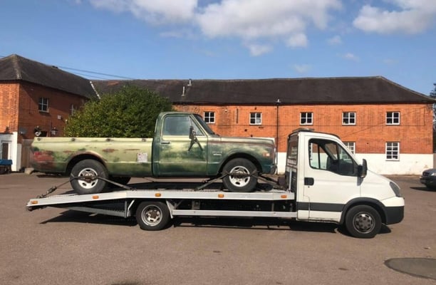 a tow truck delivering a car