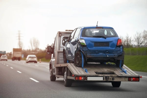 a tow truck with a flat bed