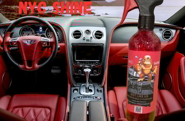 a bottle of wine in a car with a bottle of wine in the background