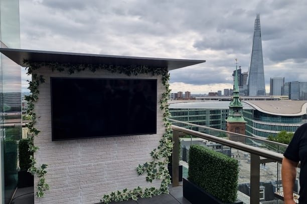 Samsung Terrace Outdoor TV mounted on a custom built media wall