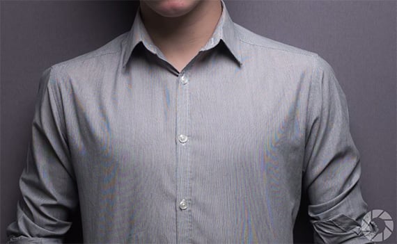 a man in a gray shirt and tie moire effect