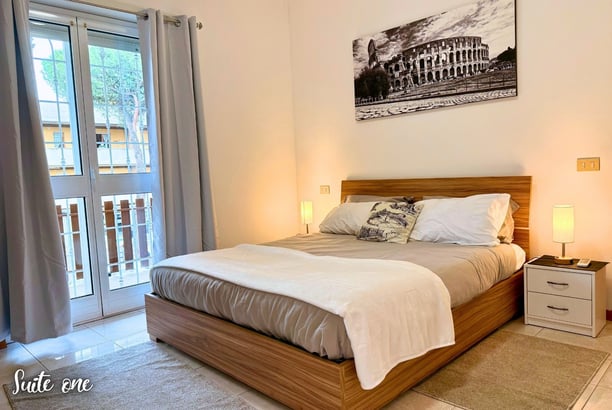 a bedroom with a bed and a balcony air conditioner
