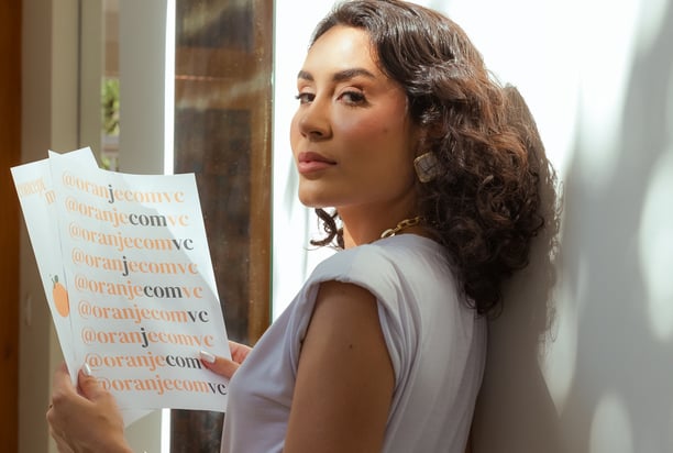 a woman in a white shirt and black pants