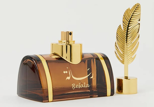 a perfume bottle with a feather feather feather feather