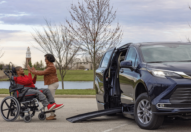 Teenager in a wheelchair getting ready to get in 