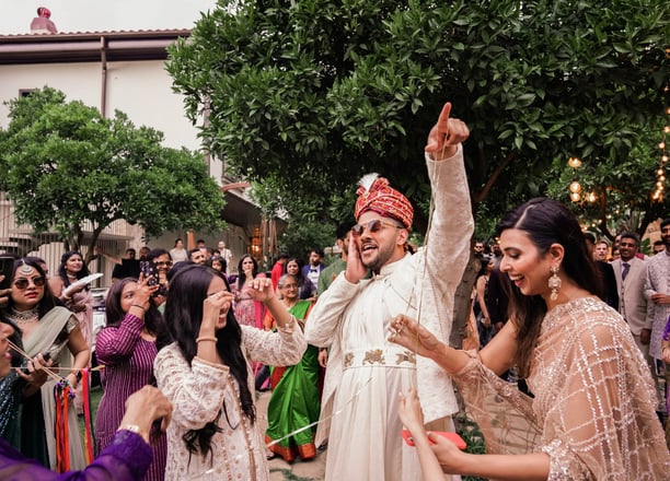 a man and woman dancing at a wedding