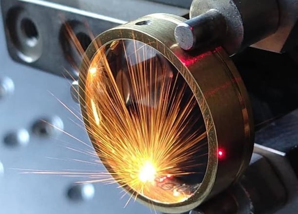 a man is welding a piece of metal